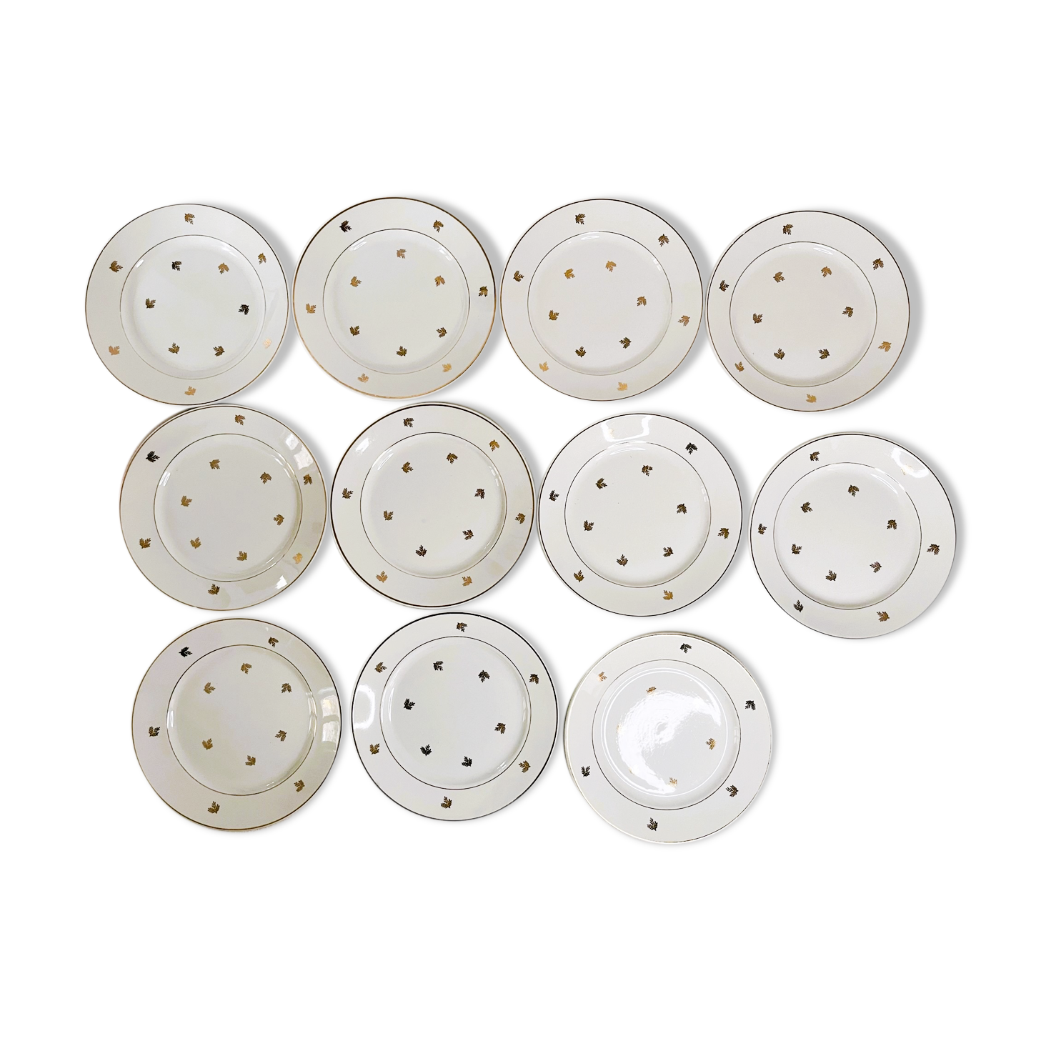 11 plates in antique earthenware decorated with golden leaves and golden border