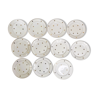 11 plates in antique earthenware decorated with golden leaves and golden border