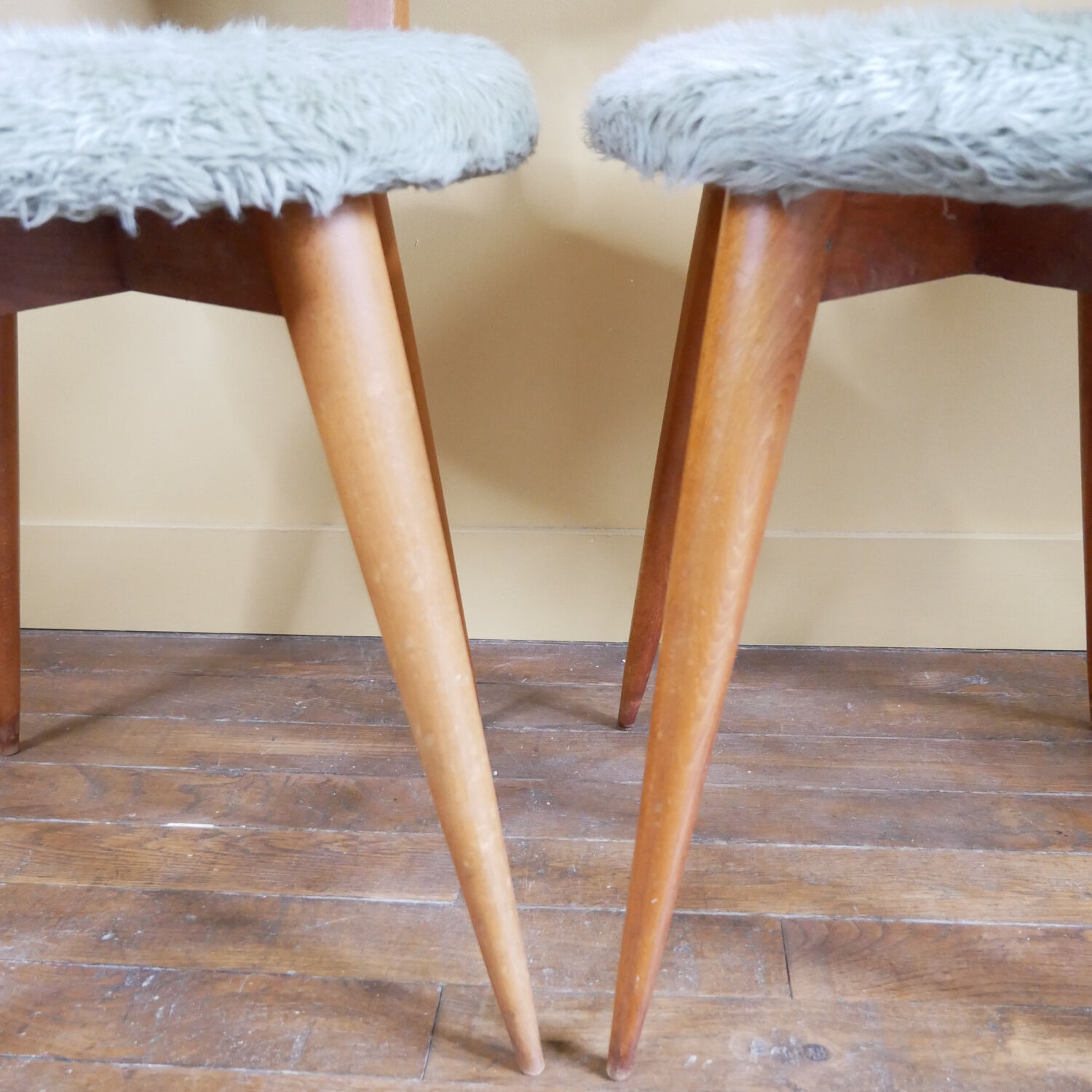 Pair of moumoute chairs with compass feet