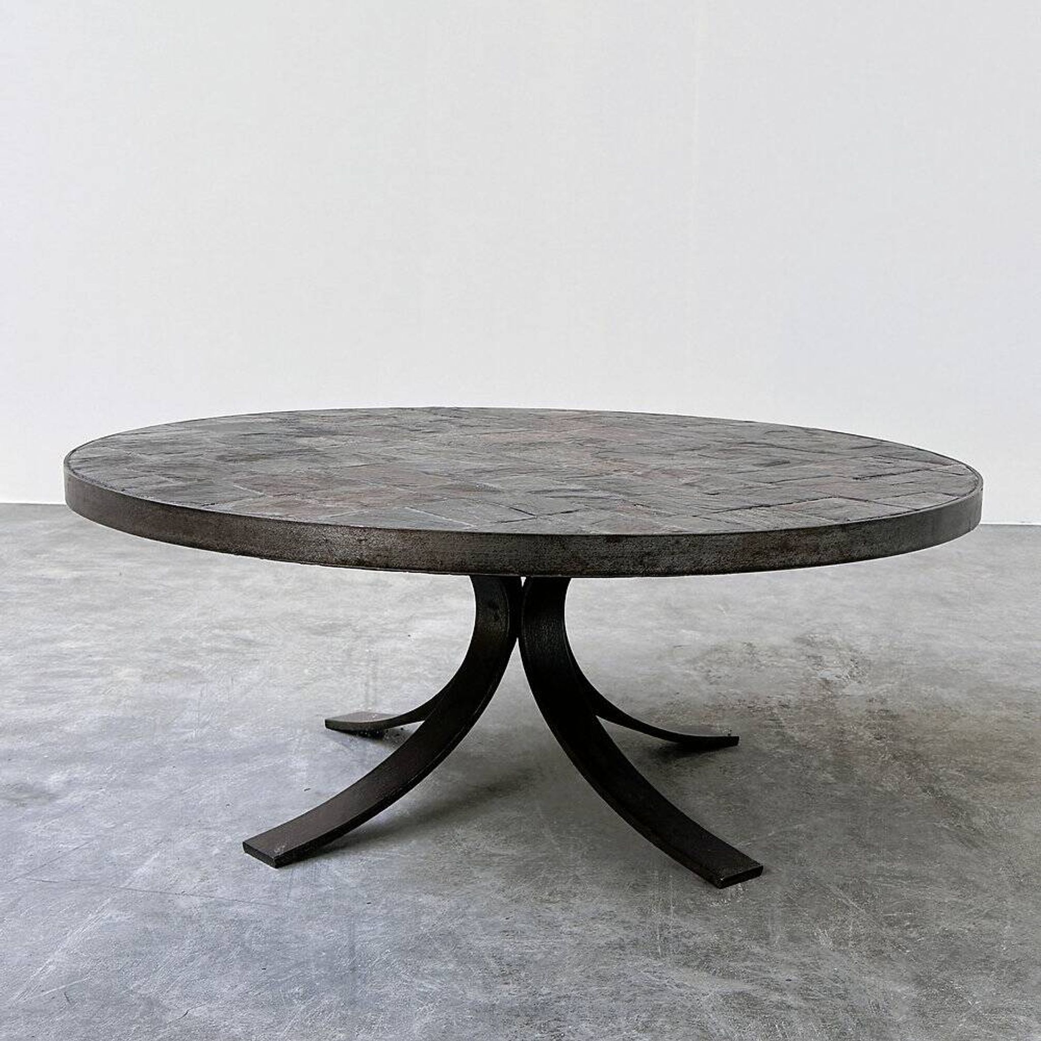 1970s round slate stone mosaic coffee table with sculptural metal base