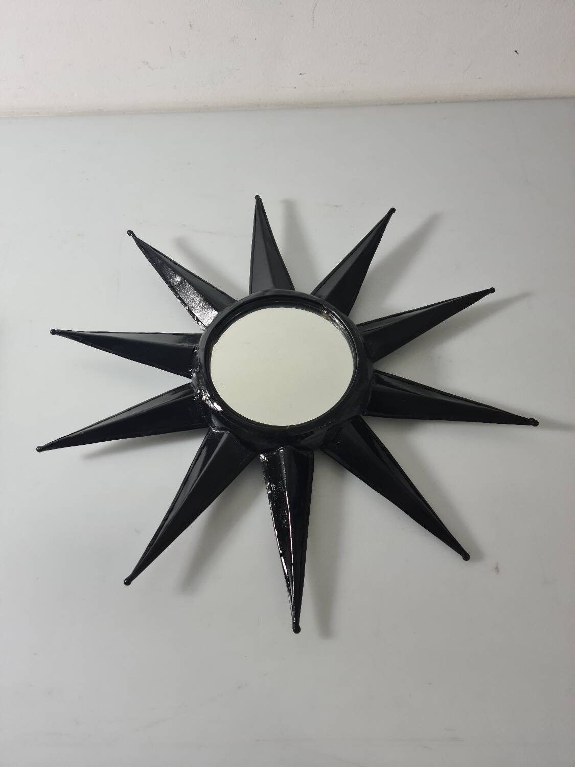 Antique metal star wall mirror black