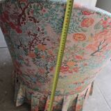 pair of toad armchairs in floral fabric.