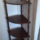 Corner shelf on wooden legs