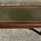 Vintage English coffee table in oak and green leather – 1950s/60s
