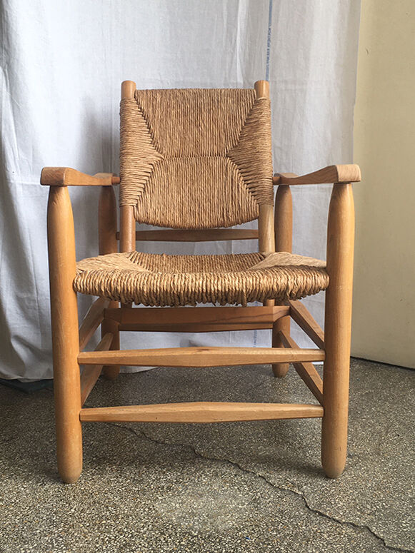"Paillé" armchair by Charlotte Perriand