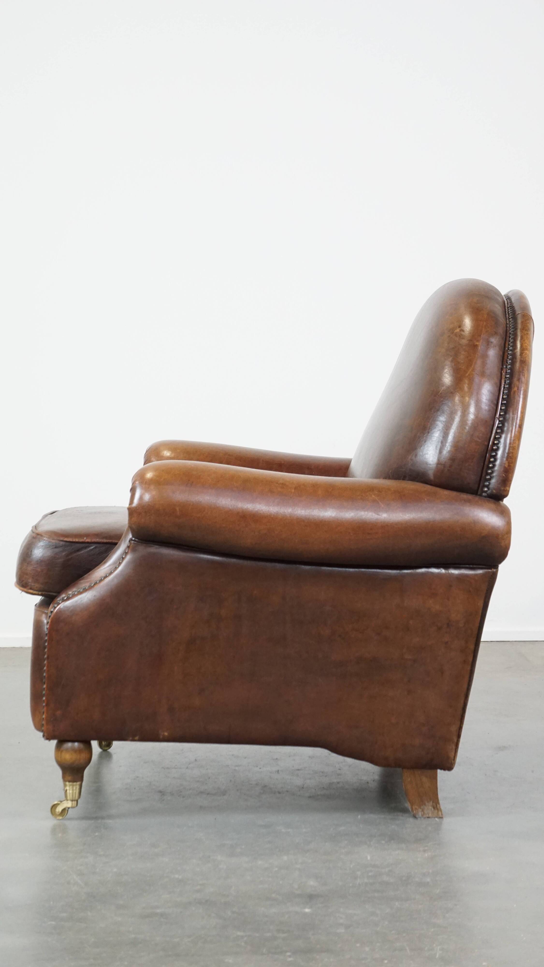 Sheep leather armchair on wheels