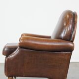 Sheep leather armchair on wheels