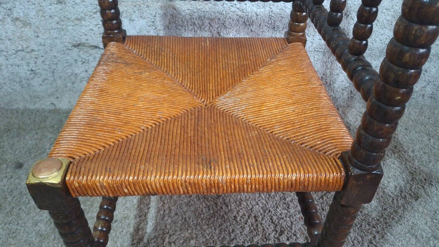 Fireplace corner chair in Louis XIII style, turned wood with braided rush, 19th century.