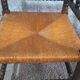Fireplace corner chair in Louis XIII style, turned wood with braided rush, 19th century.