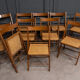 Suite de 11 chaises pliantes avec cannage 1980 entourage bois