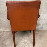 Brown leather effect Skaï bridge armchair