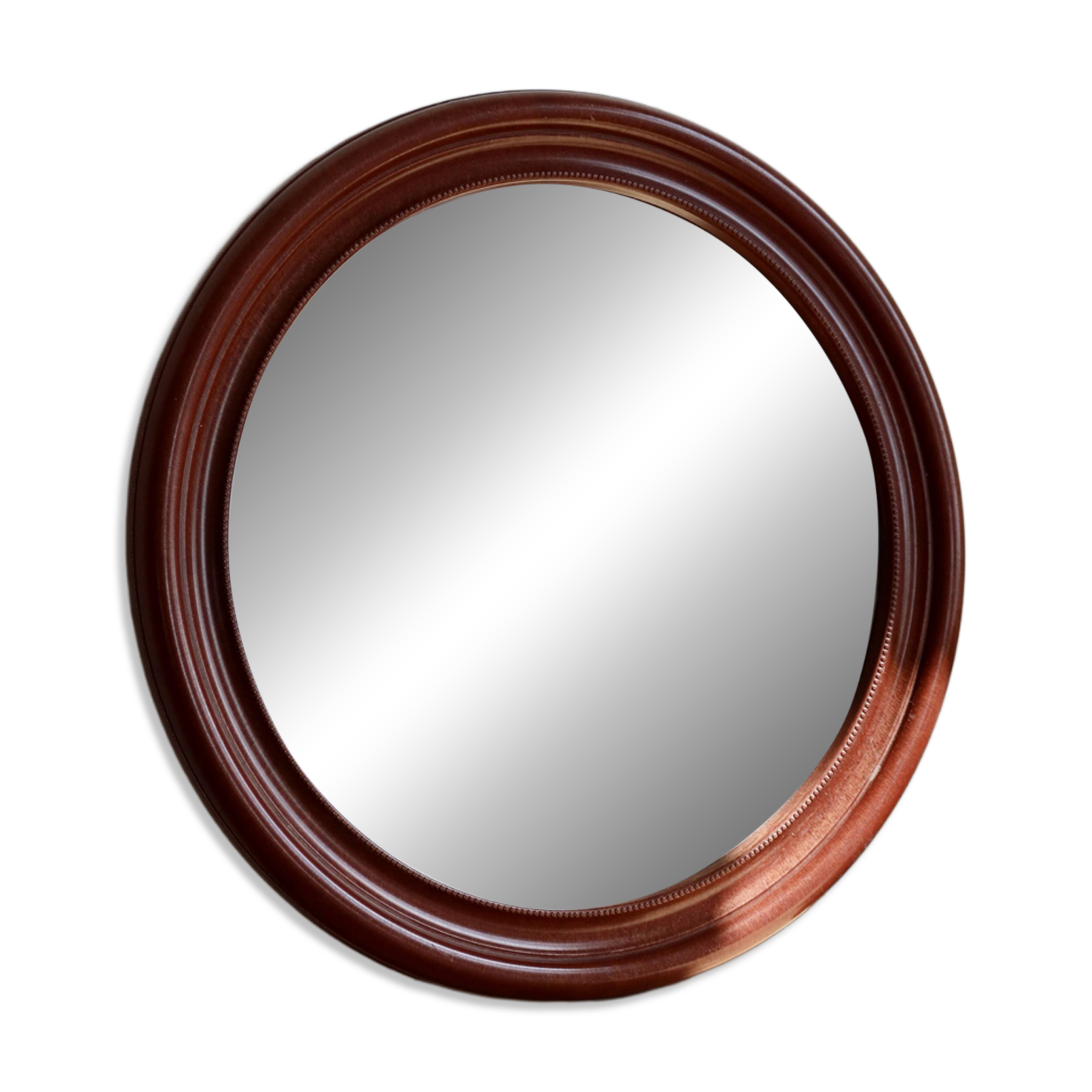 Round vintage mirror with mahogany wood effect frame.