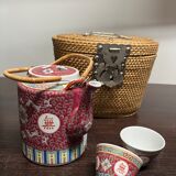 Chinese porcelain tea set in its portable wicker basket