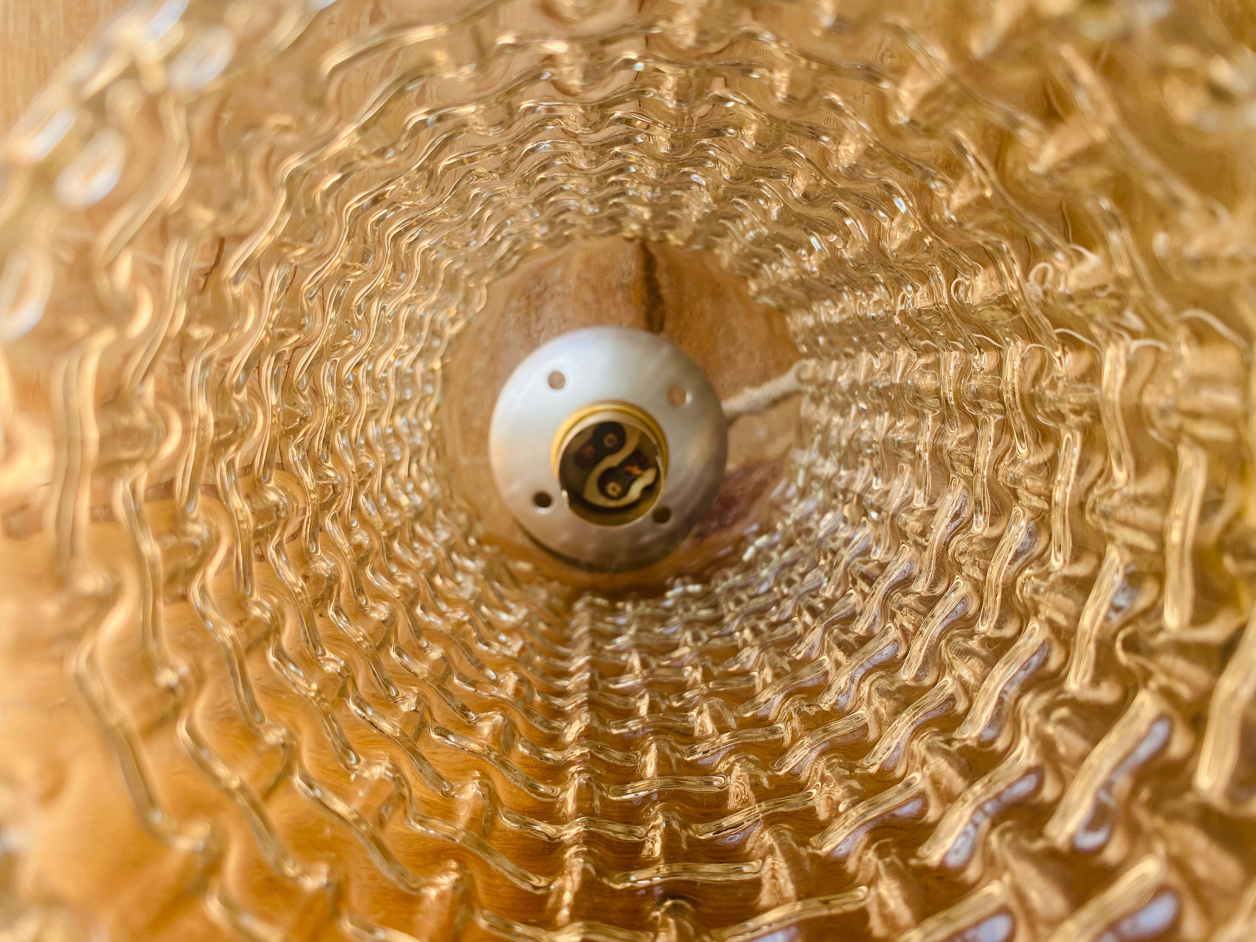 Glass and brass suspension.