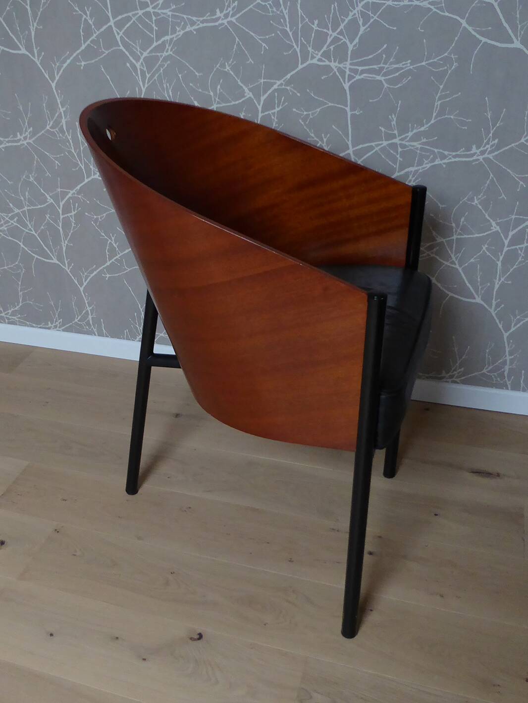 Coste mahogany and black armchair