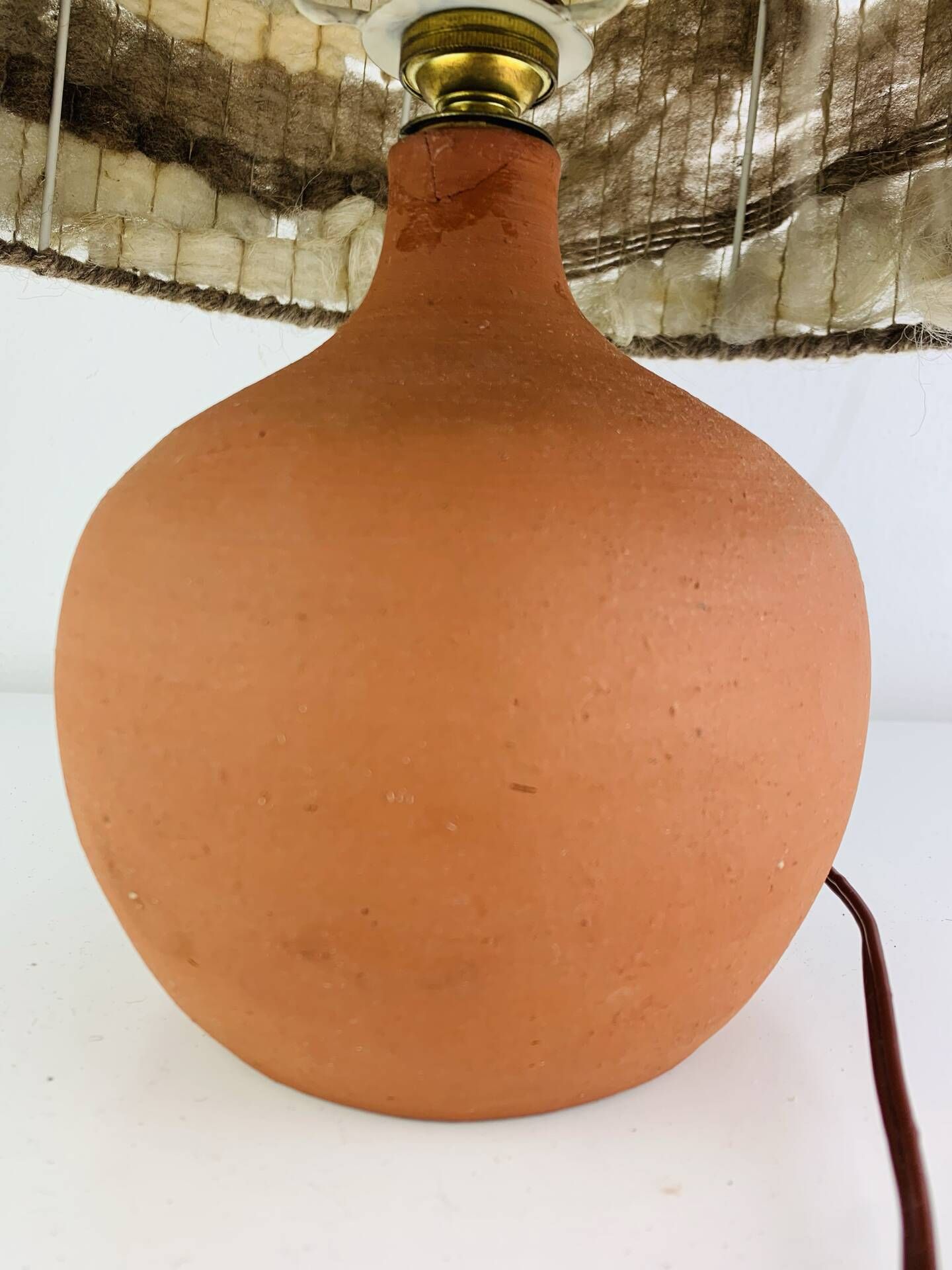 Terracotta globe lamp with a wool shade from the 1960s.
