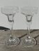 Pair of clear glass candlesticks, signed