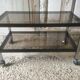 Metal coffee table with smoked glass.