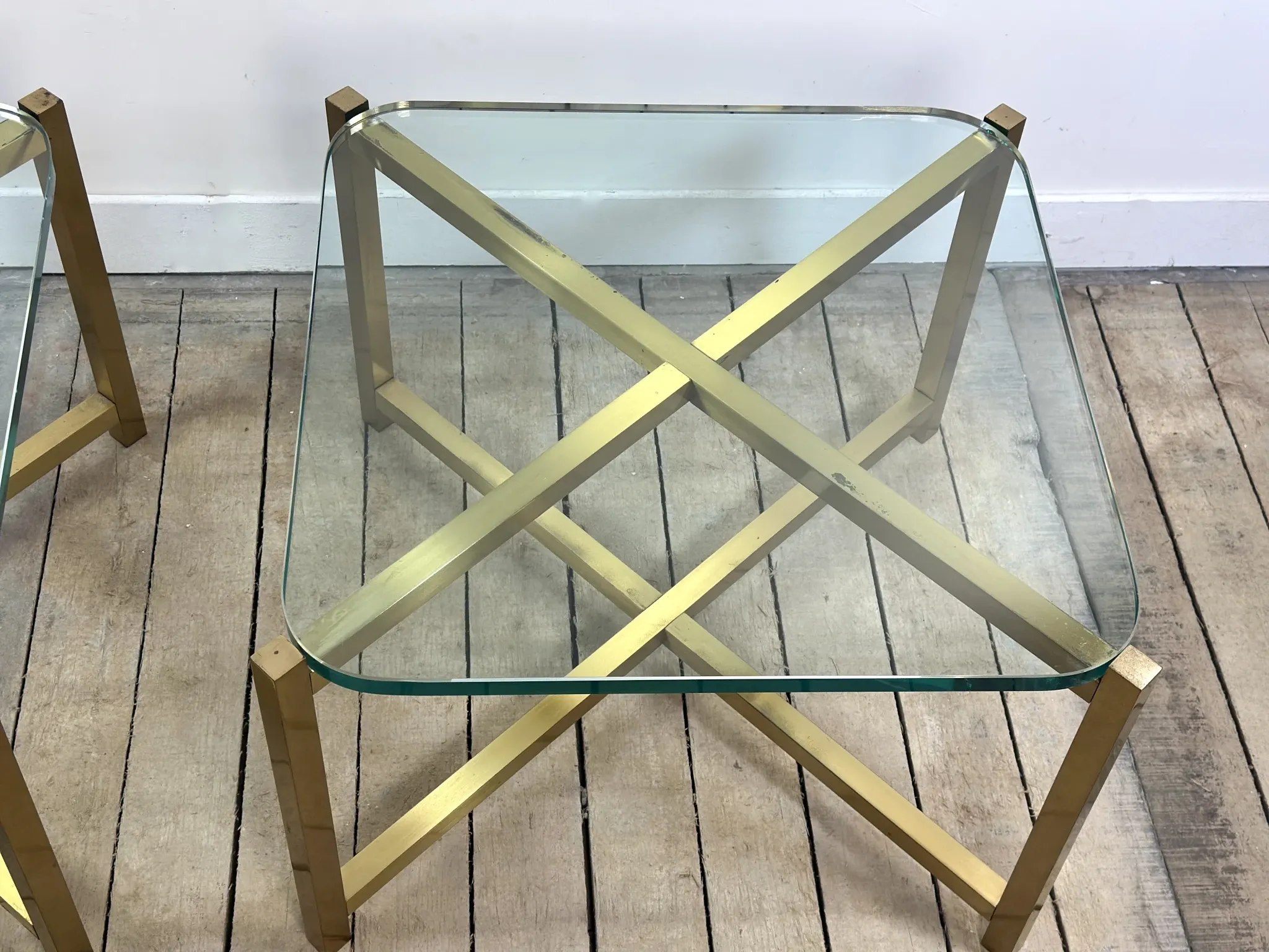 Pair of Italian brass and glass side tables from the 1970s.