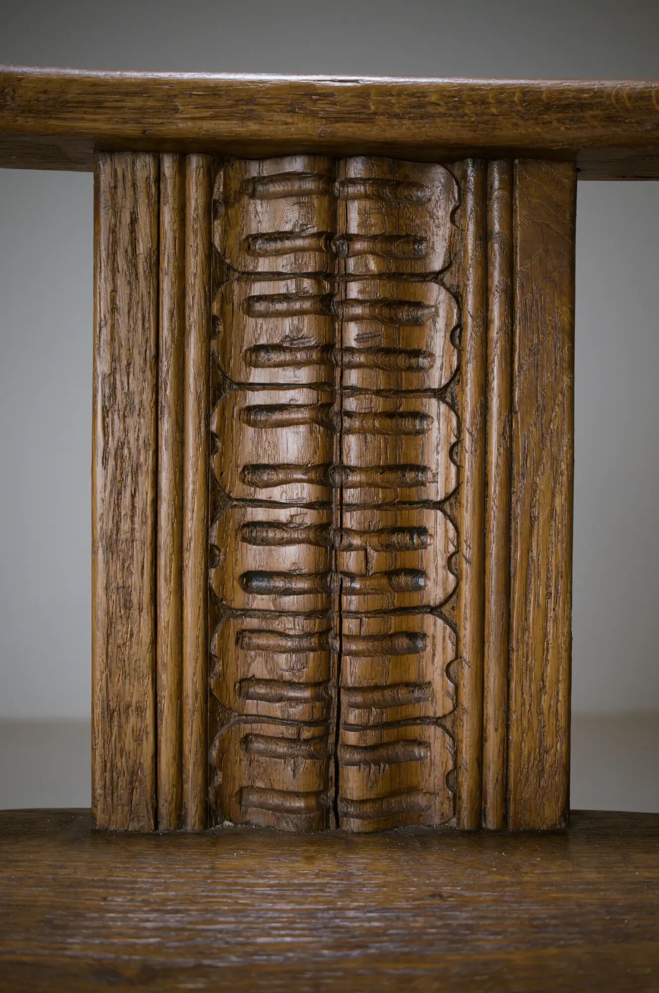Swivel armchair in carved oak with ball bearings, early 20th century.