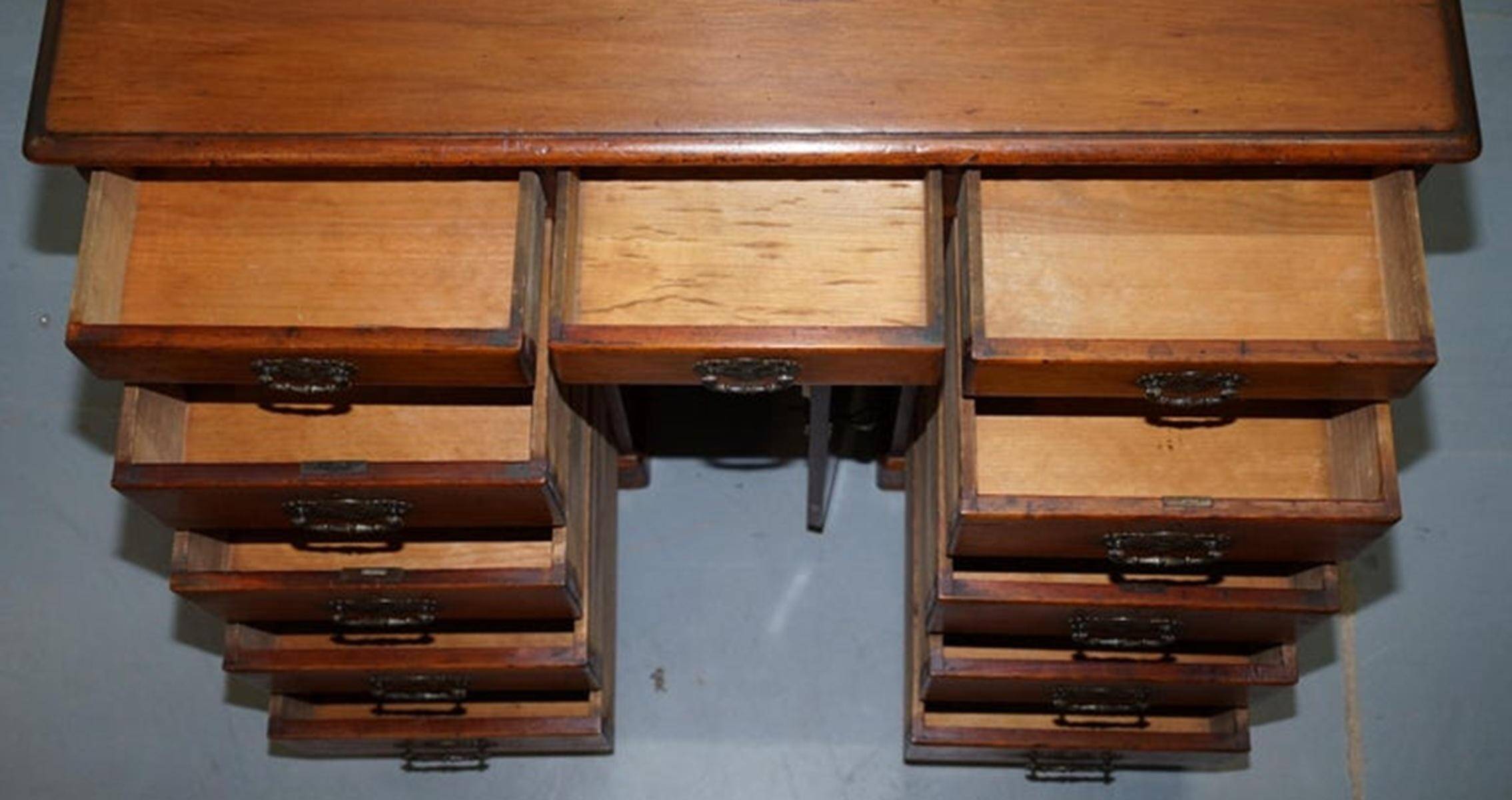 Small Victorian desk in solid walnut with drawers.