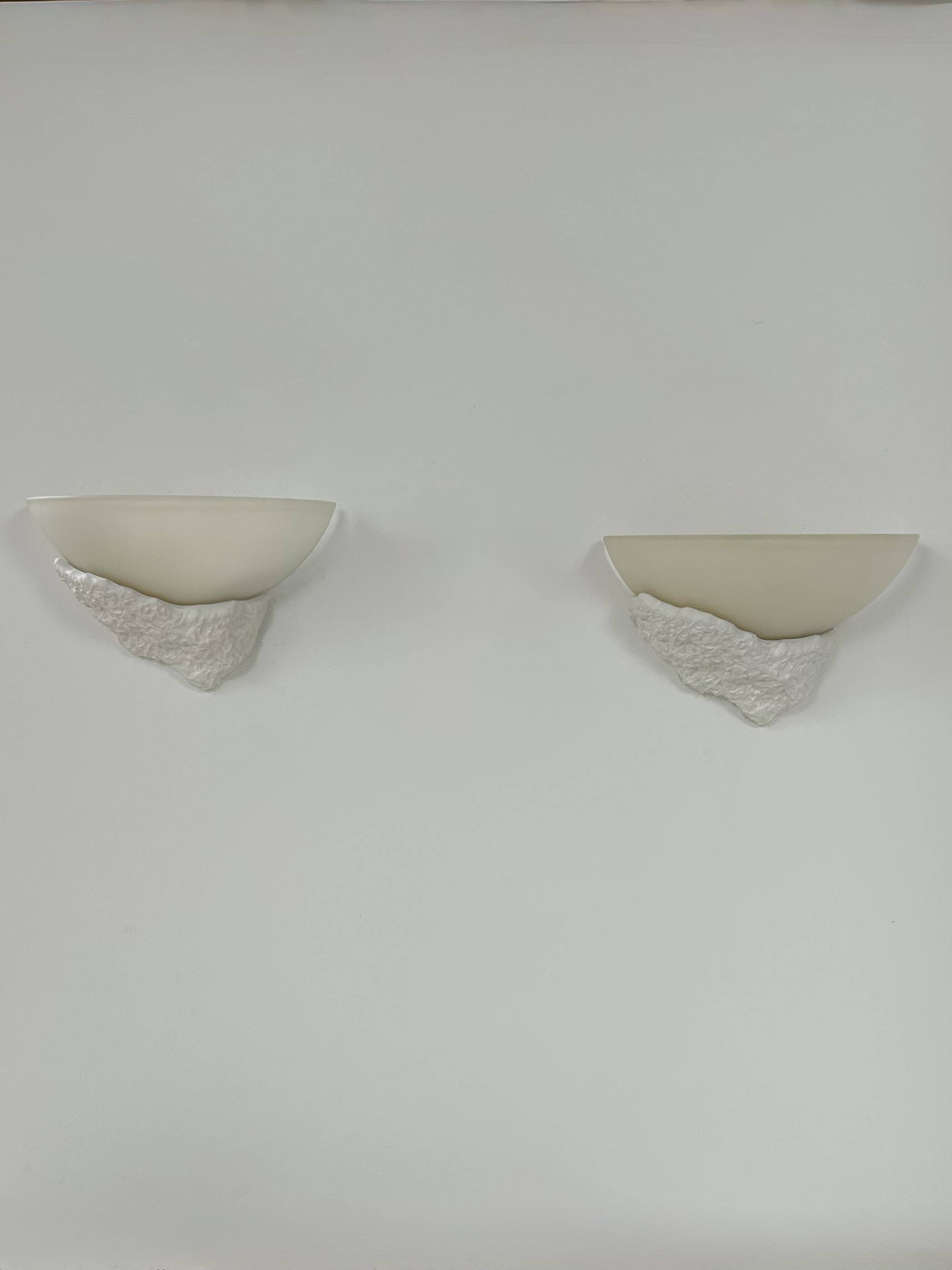 Pair of plaster and frosted glass wall lights, France, 1970.