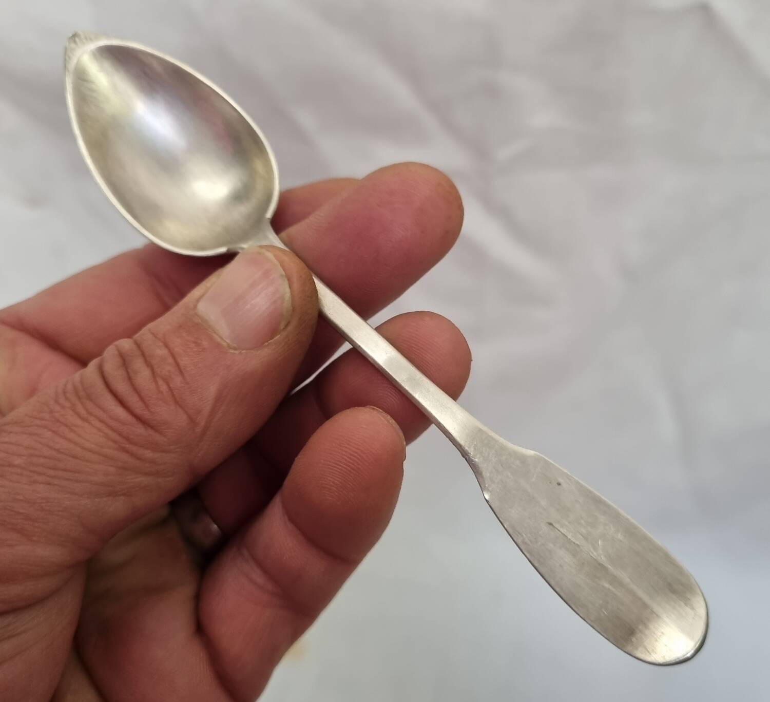 Solid silver spoon, neck brace