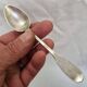 Solid silver spoon, neck brace