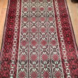Oriental carpet knotted with red hand