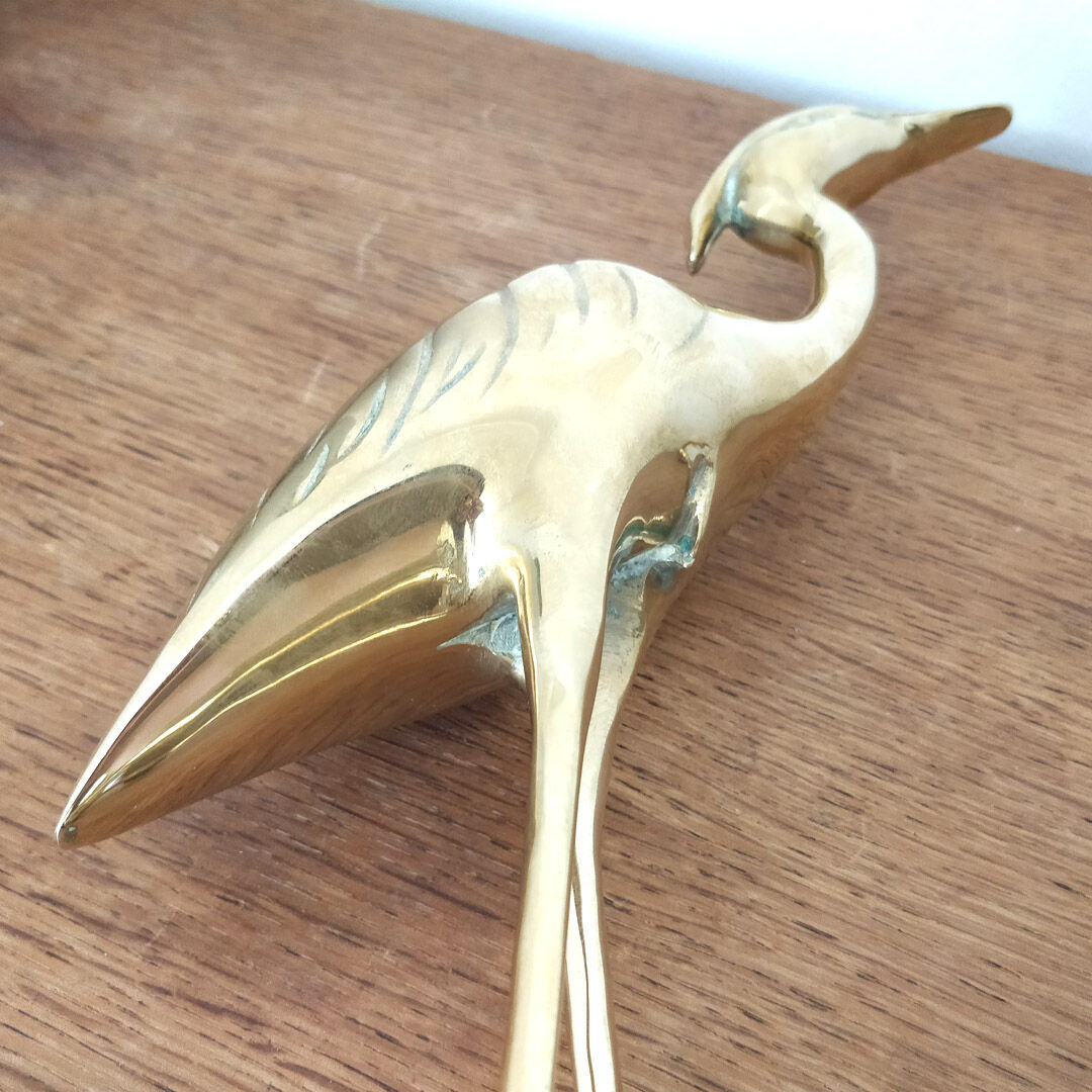 Couple large herons in polished golden brass
