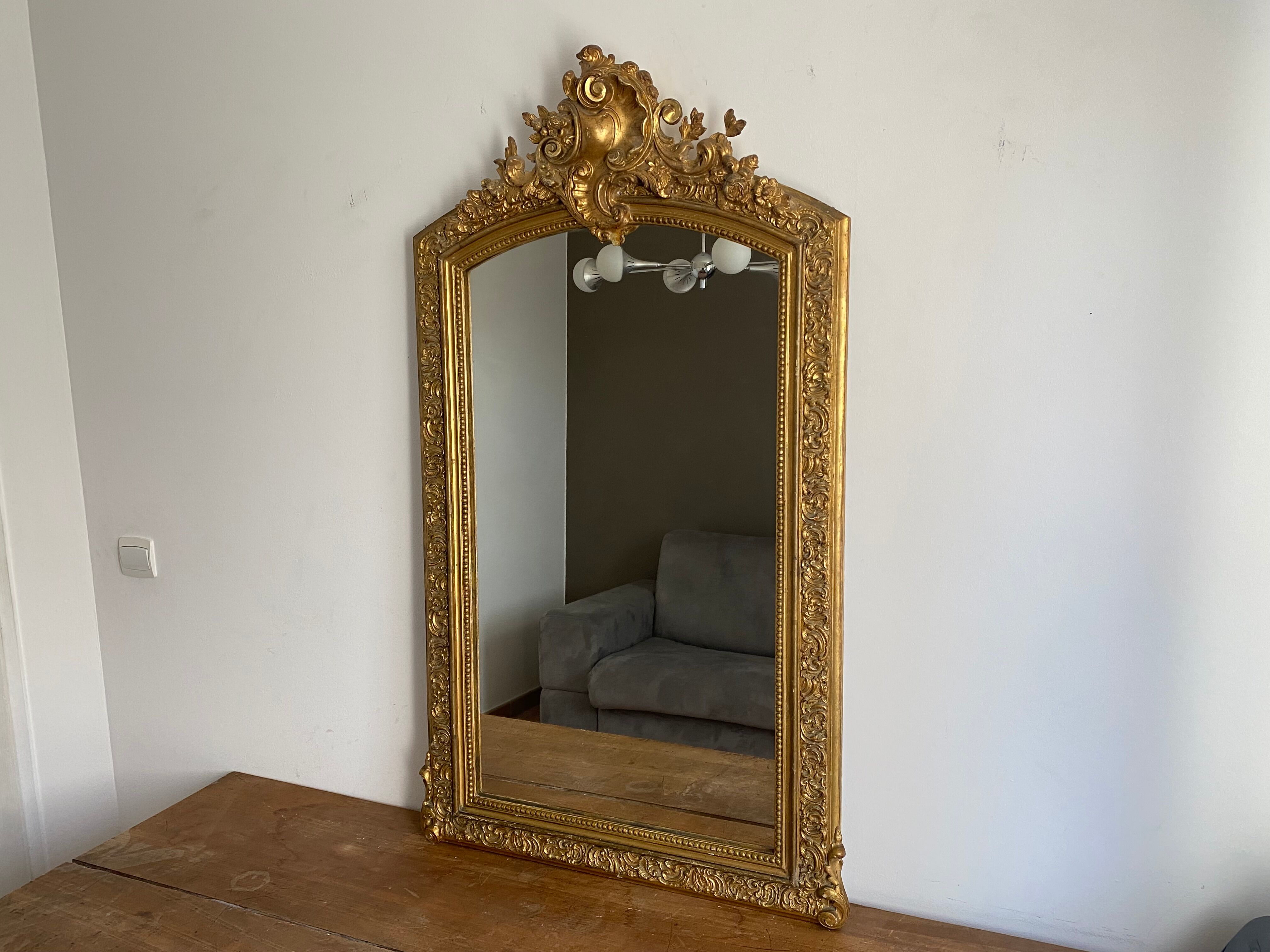 Late 19th century gilded mirror with decorated pediment 125x70cm