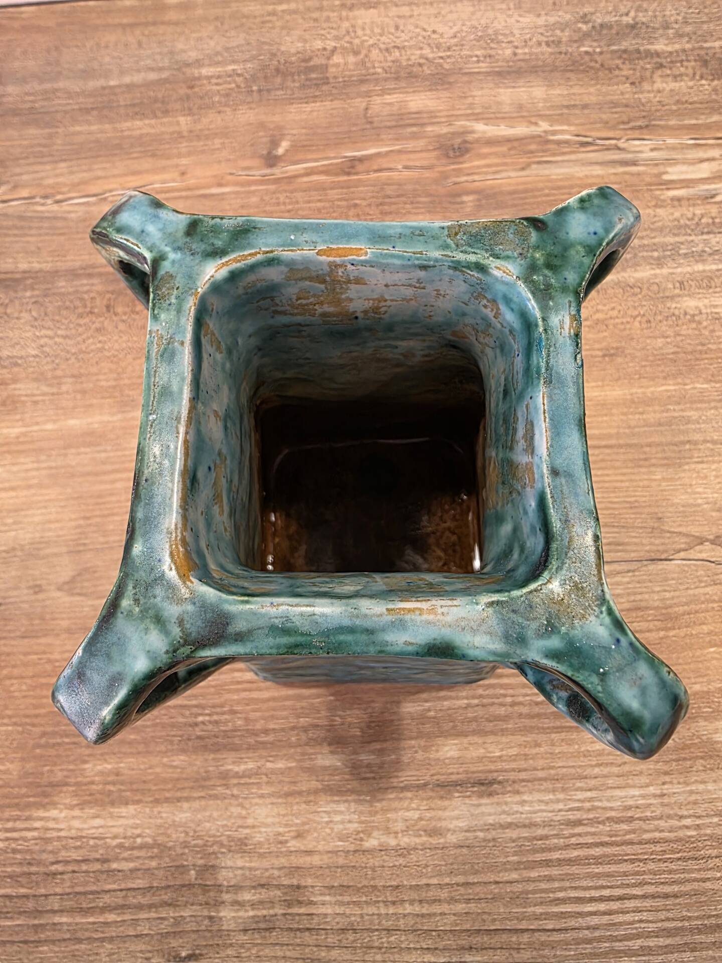 Vintage brutalist ceramic vase with 4 green handles.