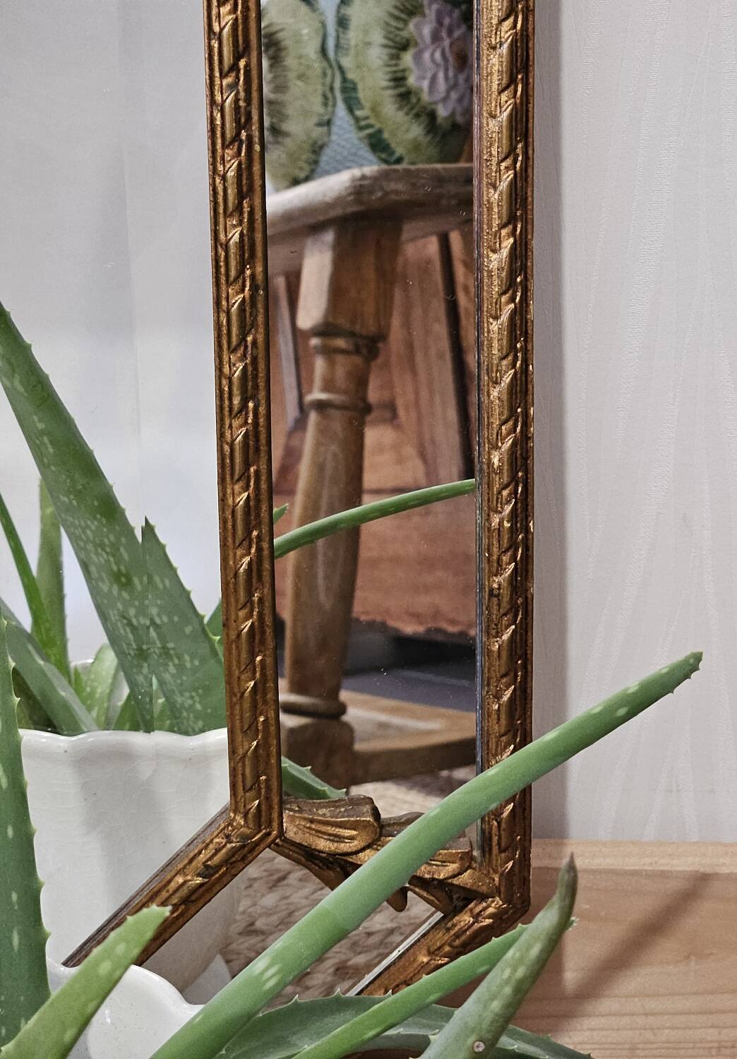 Bevelled mirror with neoclassical parcloses from the 20th century.