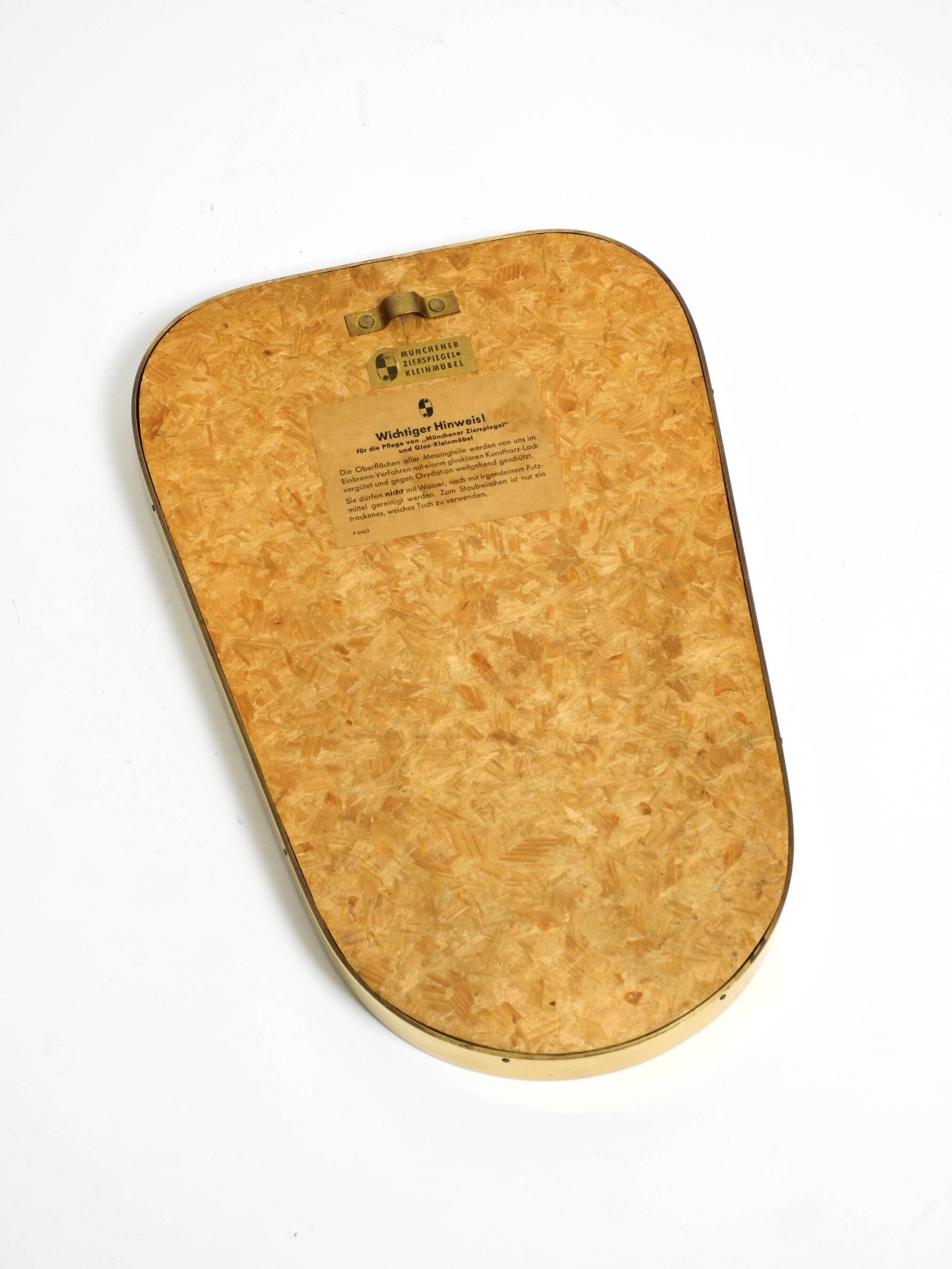 Small solid Mid Century brass wall mirror by Münchener Zierspiegel