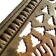Antique cast iron garden table with decorative openwork top.