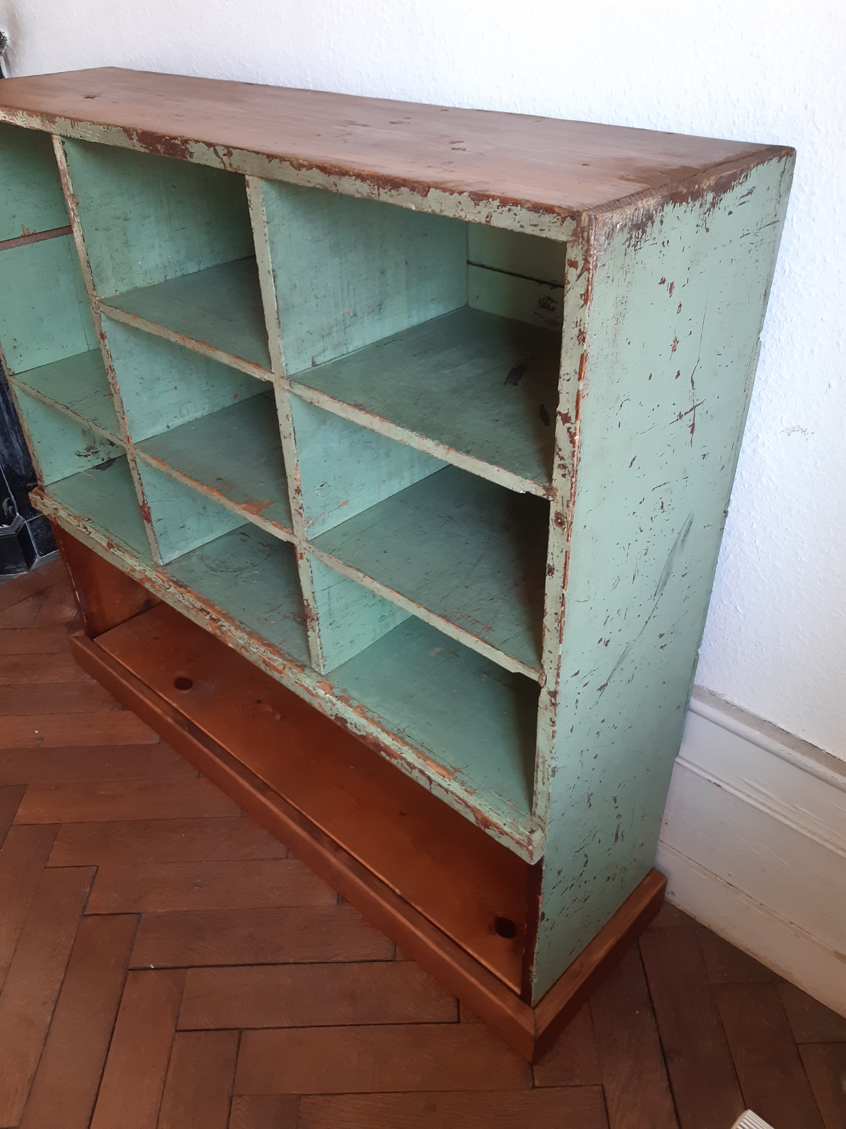 Old library shelf in patinated grocery tree