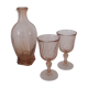 Old bottle in pink glass and 2 wine glasses