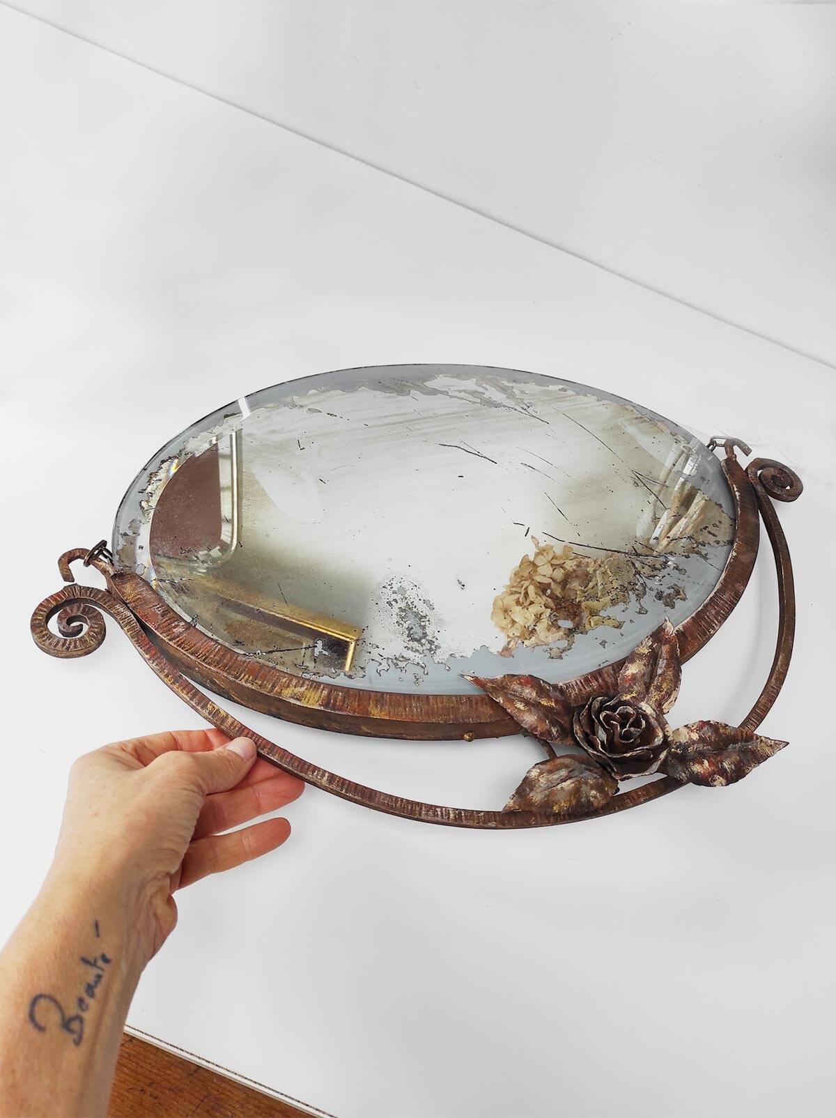 Old wrought iron mirror in the art deco style and period