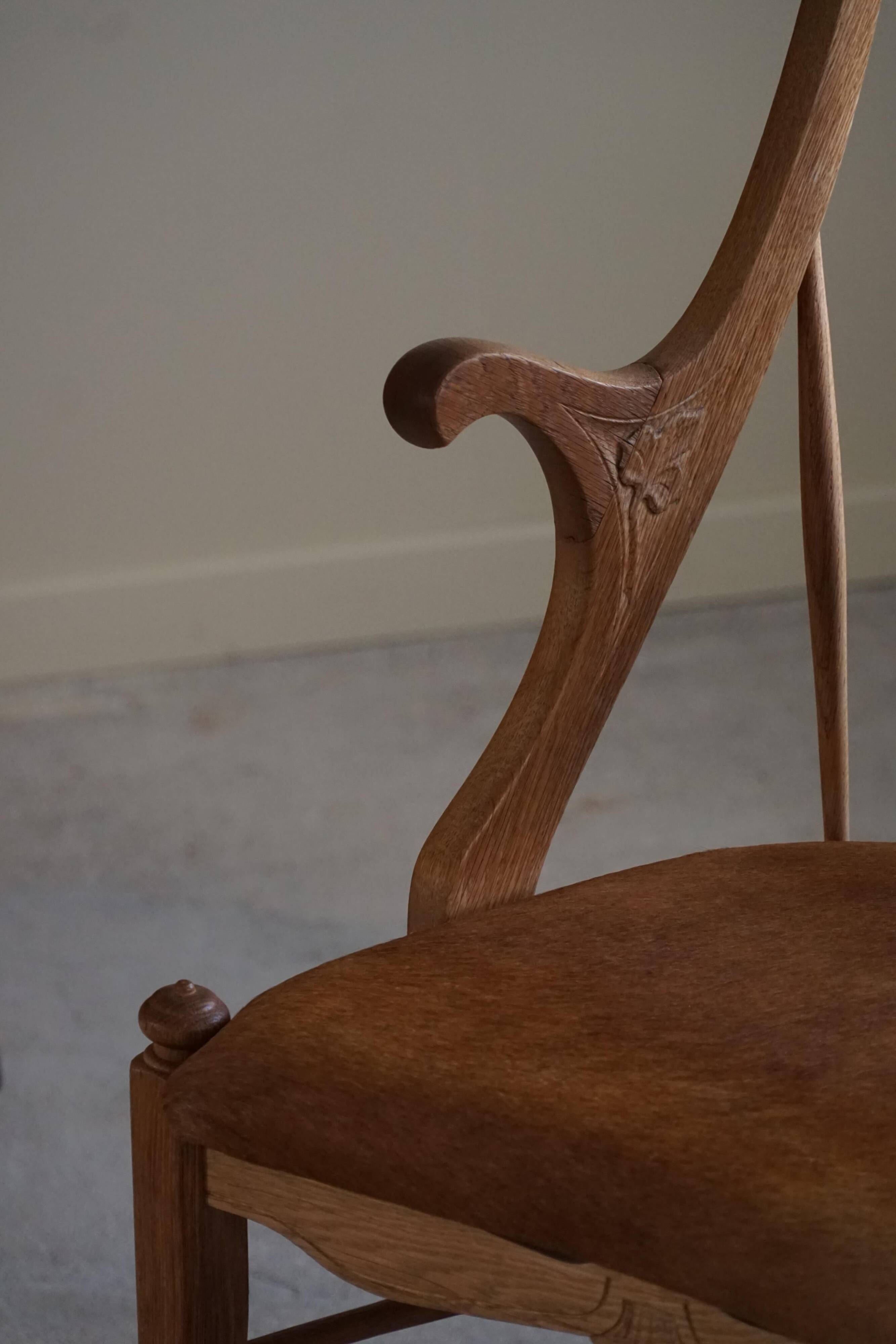 Danish high-back armchair in solid oak with leather cushion, mid-century, 1950s.