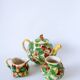 Tea service consisting of a teapot, a milk jug and a numbered hazelnut slip sugar bowl