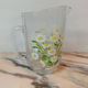 Orangeade service with a jug and six glasses featuring a daisy pattern.