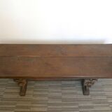 Gothic bench made of solid wood, heads of carved grotesques