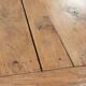 Antique pinewood coffee table with a drawer and a rural appearance
