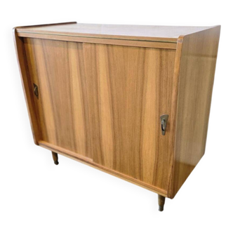 Vintage wooden armoire with sliding doors.