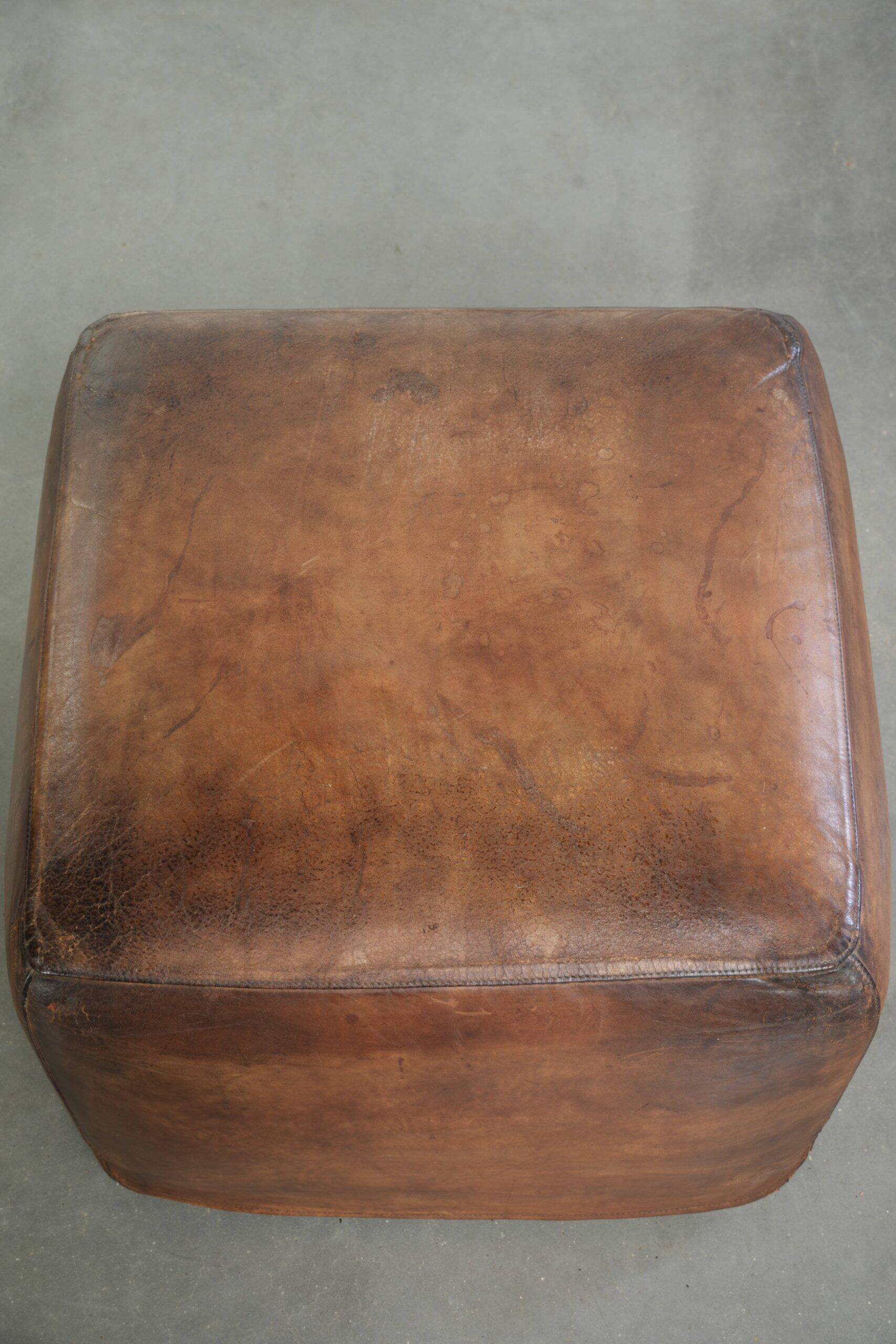 Sheepskin design ottoman with a very beautiful patina and stunning colours