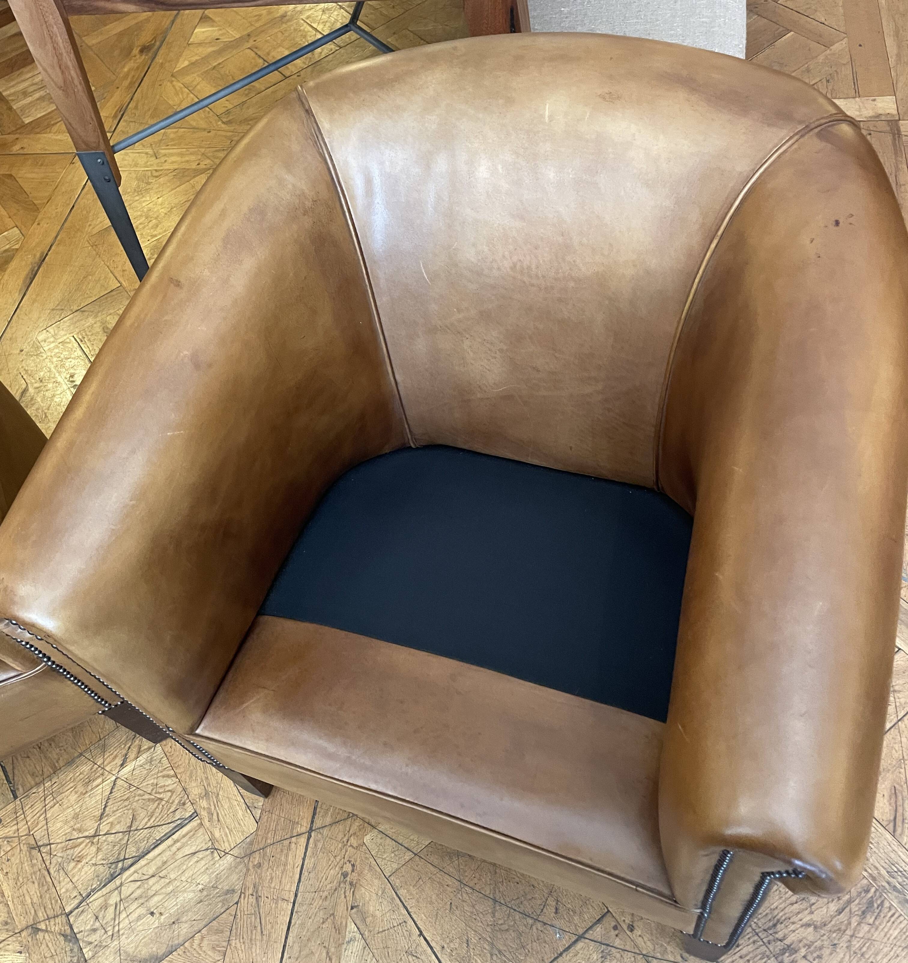 pair of camel leather club armchairs