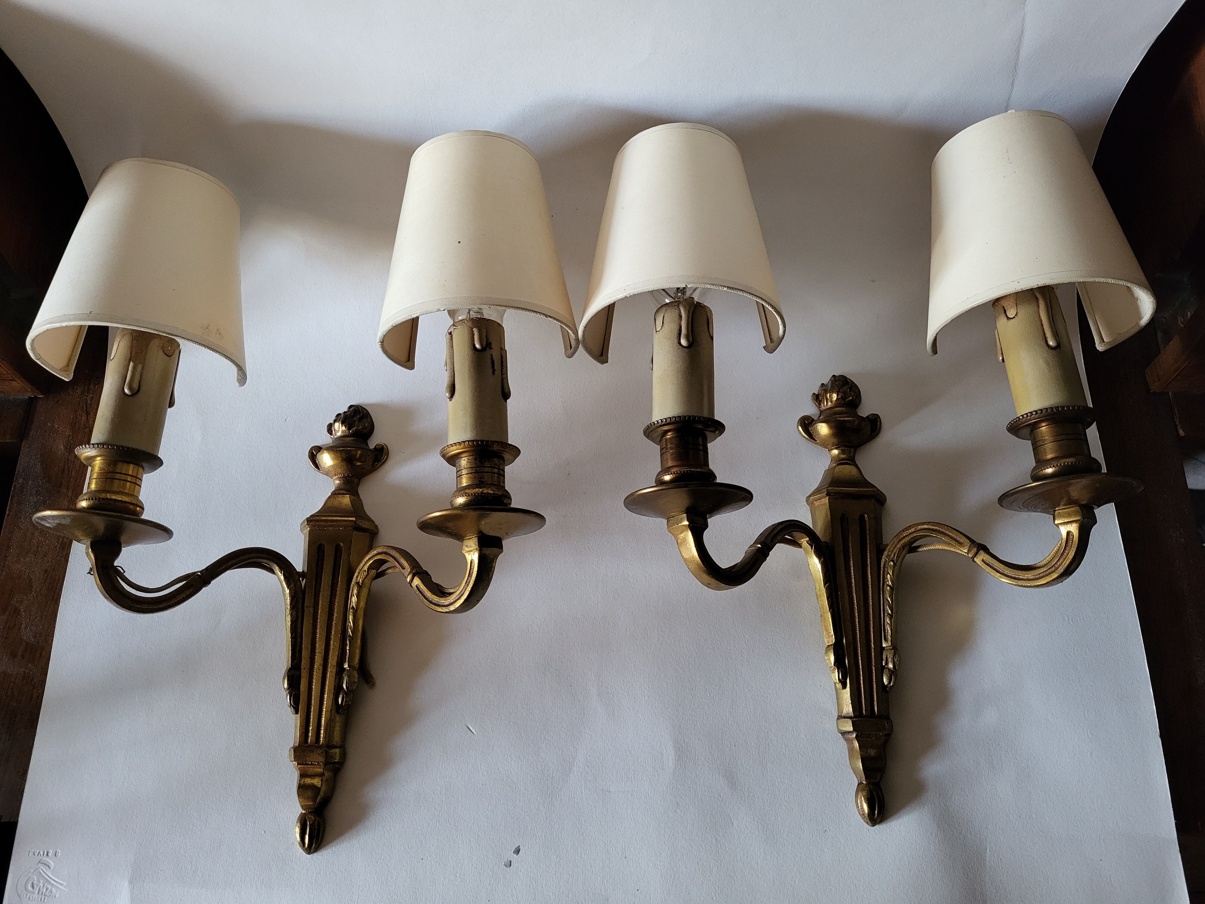 Pair of antique gilded iron wall lamps