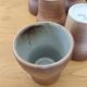 Stoneware cups – Armor stoneware set of 10 and an 11th French stoneware cup.