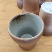 Stoneware cups – Armor stoneware set of 10 and an 11th French stoneware cup.