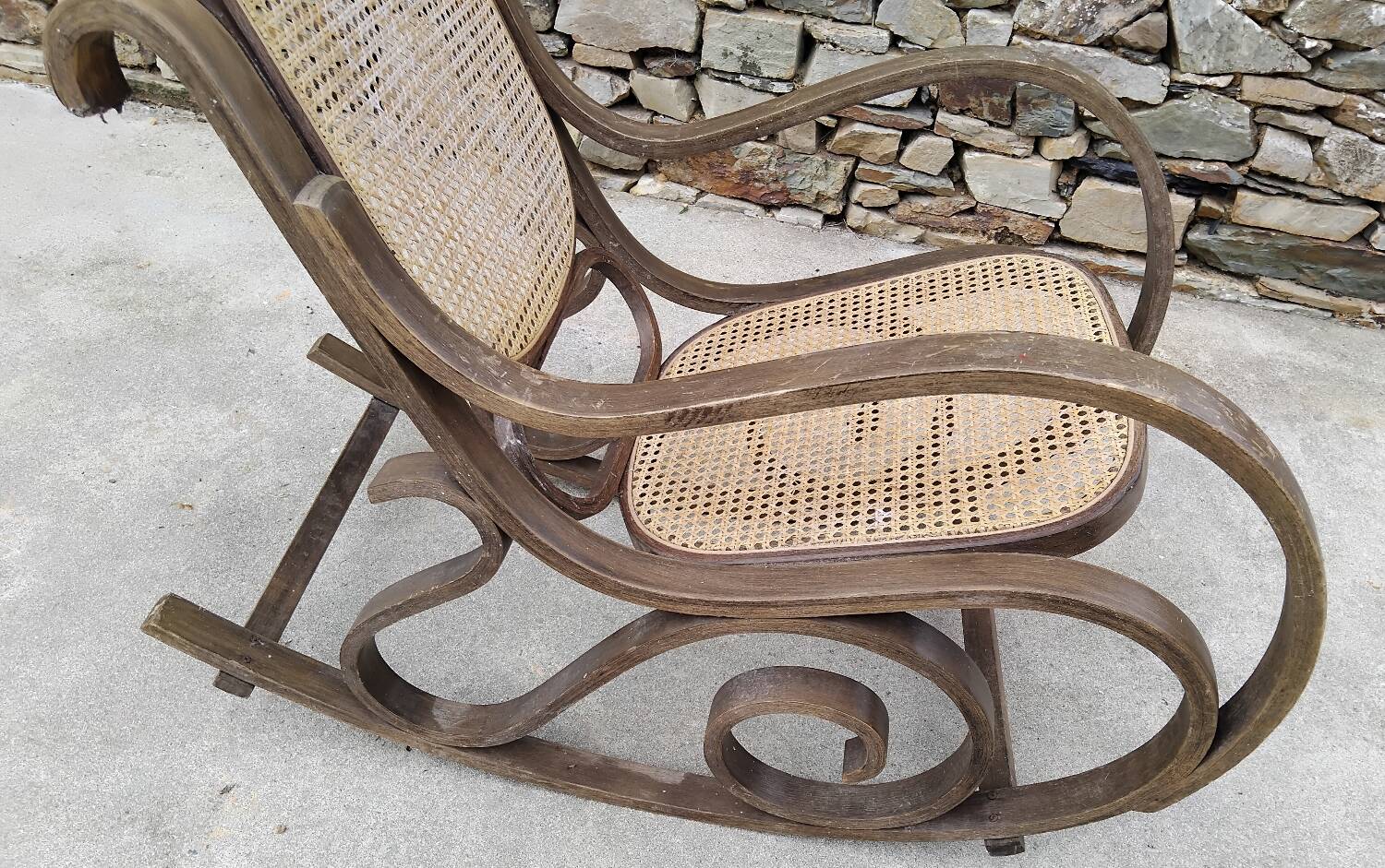 Vintage wooden and cane rocking chair